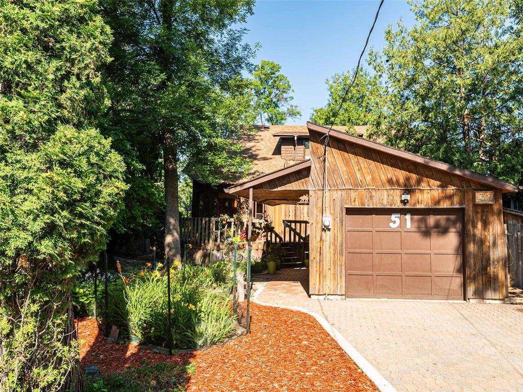Forested riverfront lot at 51 Mager Drive